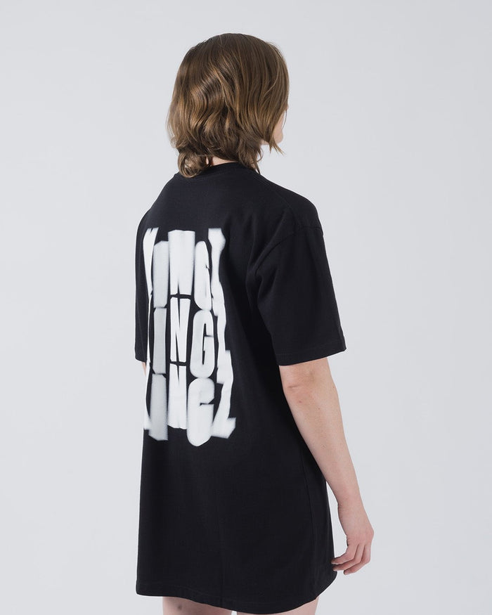 Kingz Quake Tee Black - Back View Female Model Oversized Fit Bold White KINGZ Text Vertical Back Design Short Sleeve Casual Streetwear [color:Black]