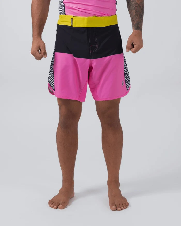 Kingz Retro Shorts Hot Pink Black Yellow - Full Body Front View Male Athlete Bold Color Block Grappling Shorts Black Upper Panel Hot Pink Lower Panel Yellow Elastic Waistband Black White Checkerboard Side Panel Inserts Crown Logo Matching Hot Pink Rashguard Bare Feet Men's No-Gi BJJ Retro Collection [color:Hot Pink/Retro]