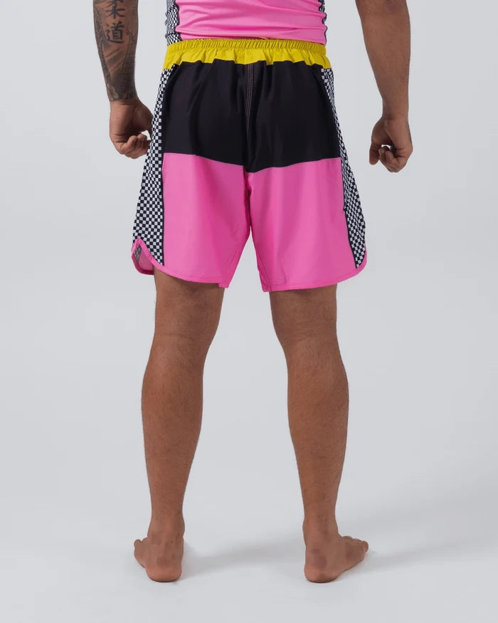 Kingz Retro Shorts Hot Pink Black Yellow - Full Body Back View Male Athlete Color Block Grappling Shorts Black Upper Panel Side Split Vent Hot Pink Lower Panel Checkerboard Side Inserts Back Hem Yellow Elastic Waistband Matching Pink Rashguard Bare Feet Men's No-Gi BJJ Retro Collection [color:Hot Pink/Retro]
