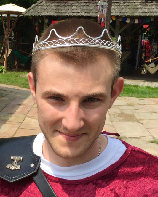 Model wearing Royal Crown silver wire headpiece, front view at a Renaissance faire.