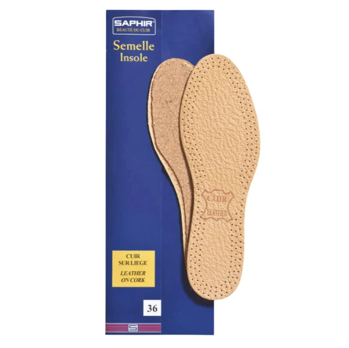 Pair of cork insoles with a Saphir branded box on a white background