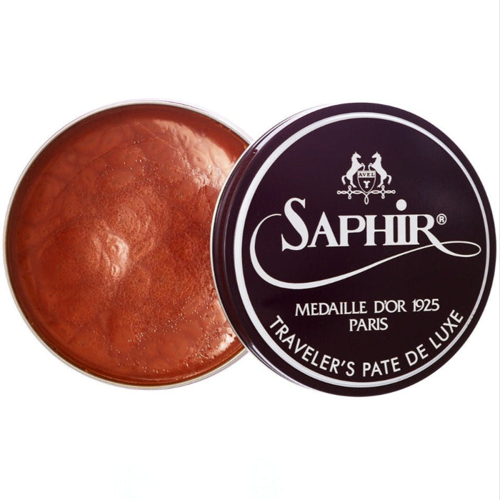 A tin of Saphir Traveler's Pate de Luxe wax shoe polish with a non-flammable formulation from KirbyAllison.com.