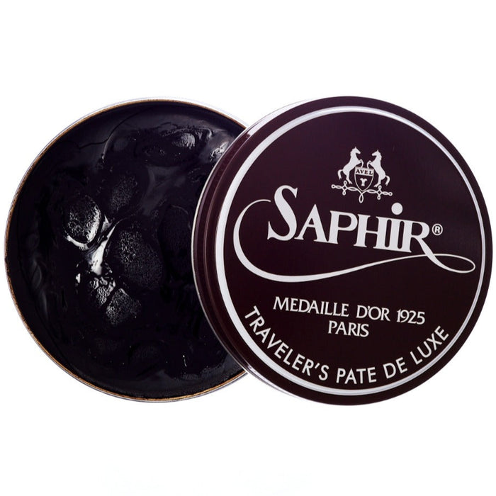 A tin of KirbyAllison.com's Saphir Traveler's Pate de Luxe Wax Shoe Polish, a wax shoe polish, on a white background.
