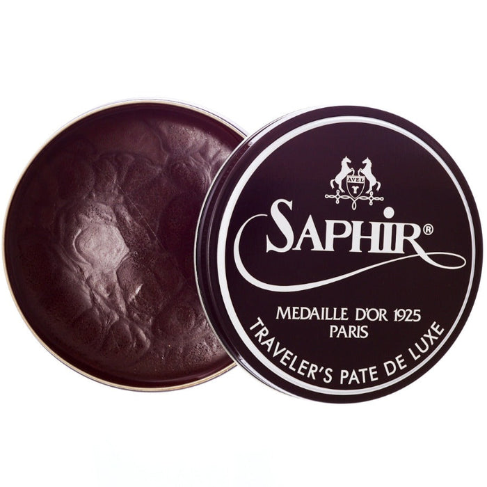 A tin with a tin of non-flammable KirbyAllison.com Saphir Traveler's Pate de Luxe wax shoe polish.