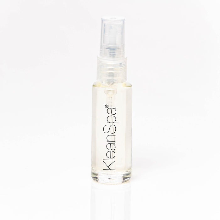 small peach scented dry oil spray