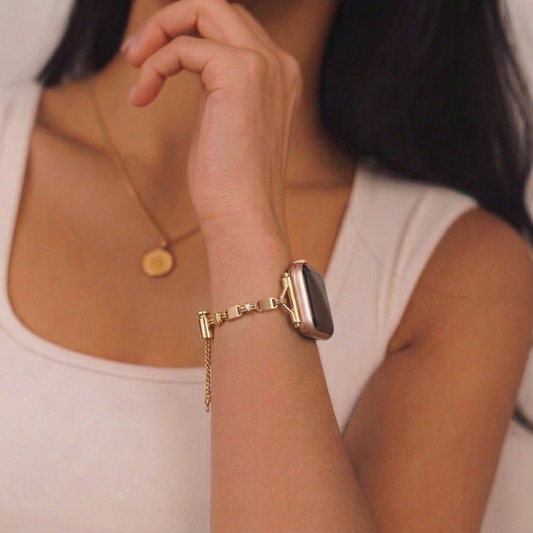 Girl wearing simple gold bracelet watch strap