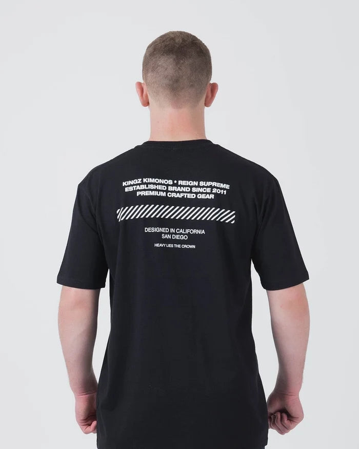 Kingz Slant Bar Tee Black - Back View Male Athlete White Text Diagonal Stripe Pattern Upper Back Premium Crafted Gear BJJ T-Shirt [color:Black]