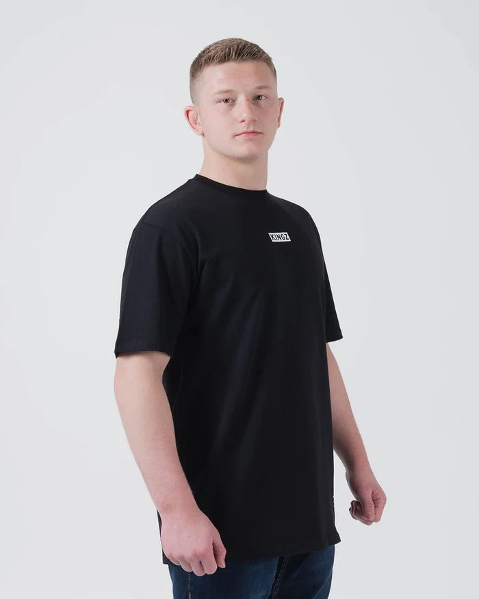 Kingz Slant Bar Tee Black - Front View Male Athlete Black T-Shirt KINGZ Logo Chest Casual Fit Short Sleeve BJJ Training Apparel [color:Black]