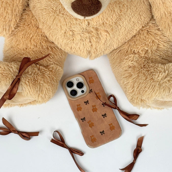 Suedette phone case with a bears and brown bows pattern on a white background by Coconut Lane.