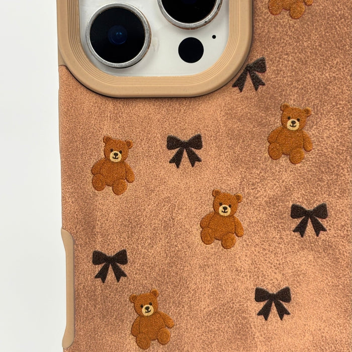 Coconut Lane suedette phone case with a bears and bows pattern in soft fabric finish.