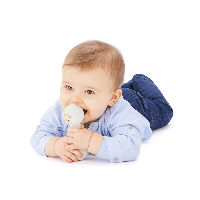 Baby playing with teething rattle