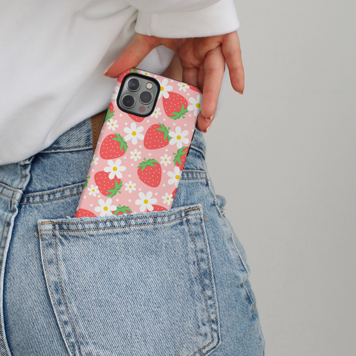 Berry Cute Strawberry phone case with red strawberry pattern in the back pocket of blue jeans.