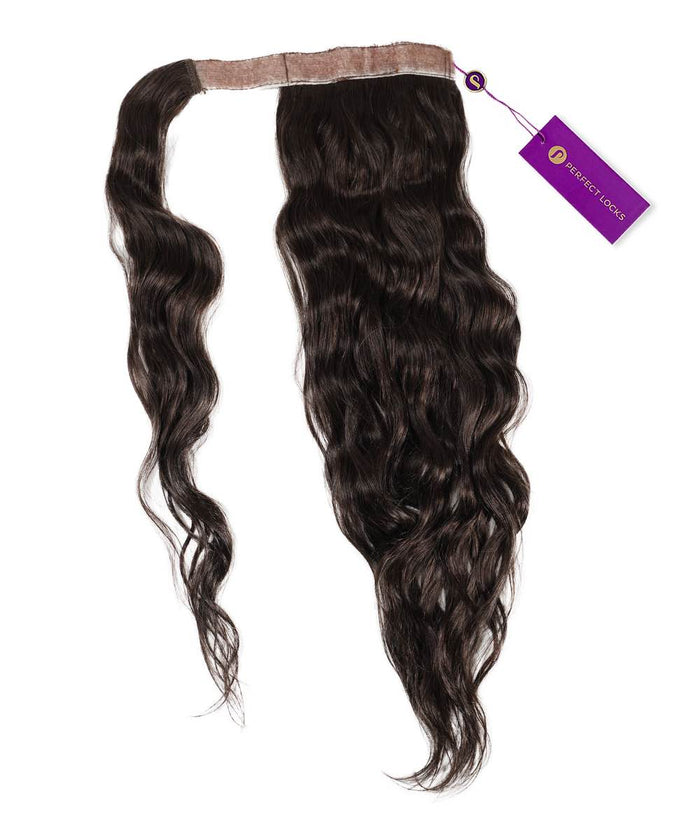 The Perfect Locks Wavy Clip-In Ponytail Extension in Natural Black  with a lace band and purple tag on a white background.#color_natural-black-(1B)
