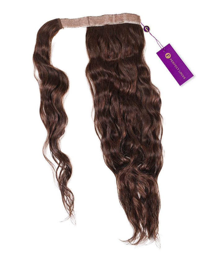 The Perfect Locks Wavy Clip-In Ponytail Extension in Chocolate Brown  with a wavy texture, beige band, and purple tag on white.#color_chocolate-brown-(3)