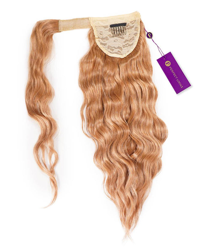 A wavy honey blonde  Remy hair extension labeled Wavy Clip-In Ponytail Extensions by Perfect Locks on a white background.#color_honey-blonde-(27)