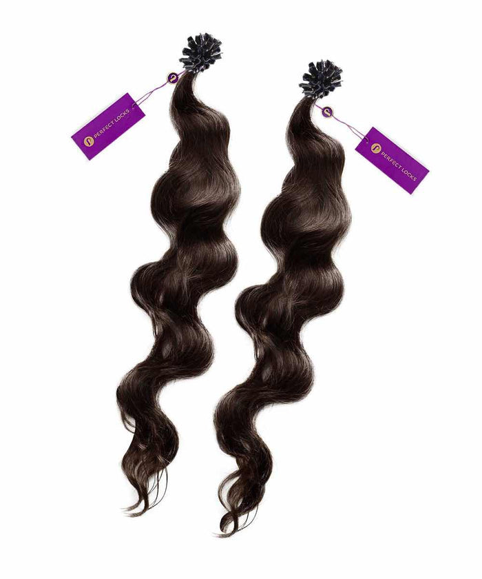 Two bundles of dark brown, wavy hair extensions with purple tags at the top, arranged against a white background.