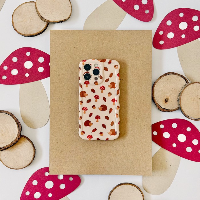 Brown wavy phone case with a mushroom and woodland pattern by Coconut Lane.