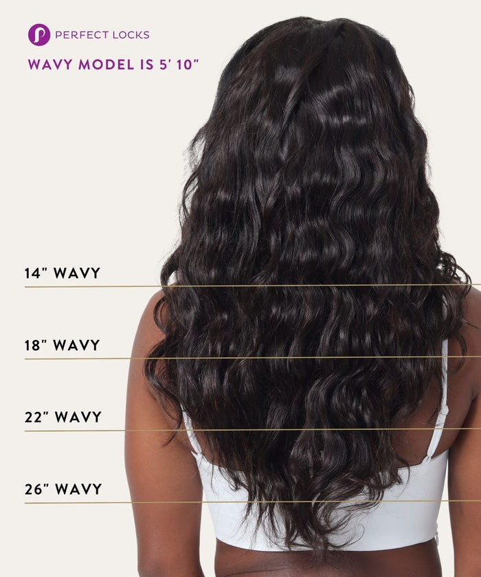 A woman with long, wavy dark hair in a white top shown from the back, displaying weft lengths; model is 5'10" with Remy extensions.